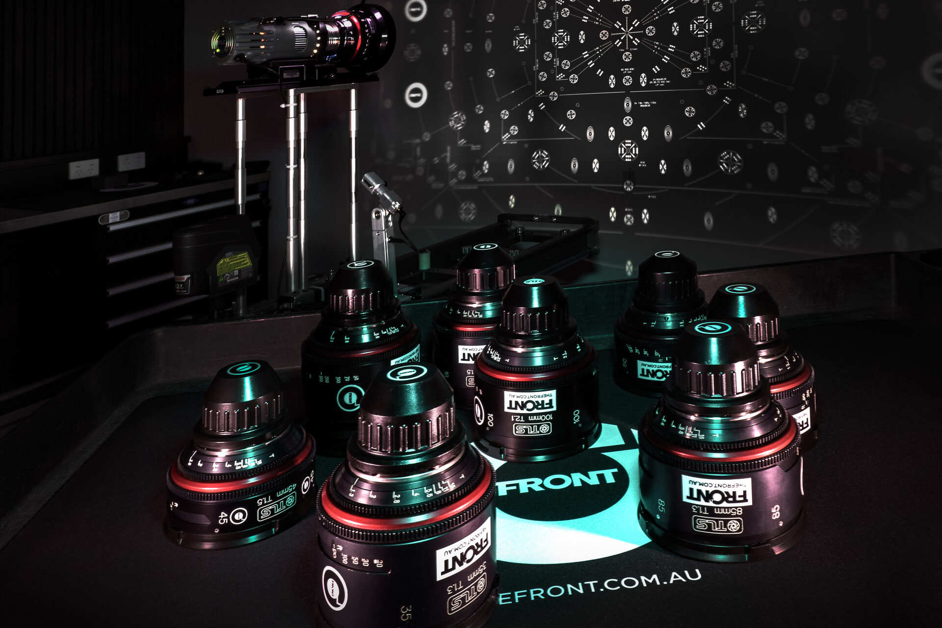 A full set of The Front's cine primes in the Lens Room with the lens projector and star chart behind