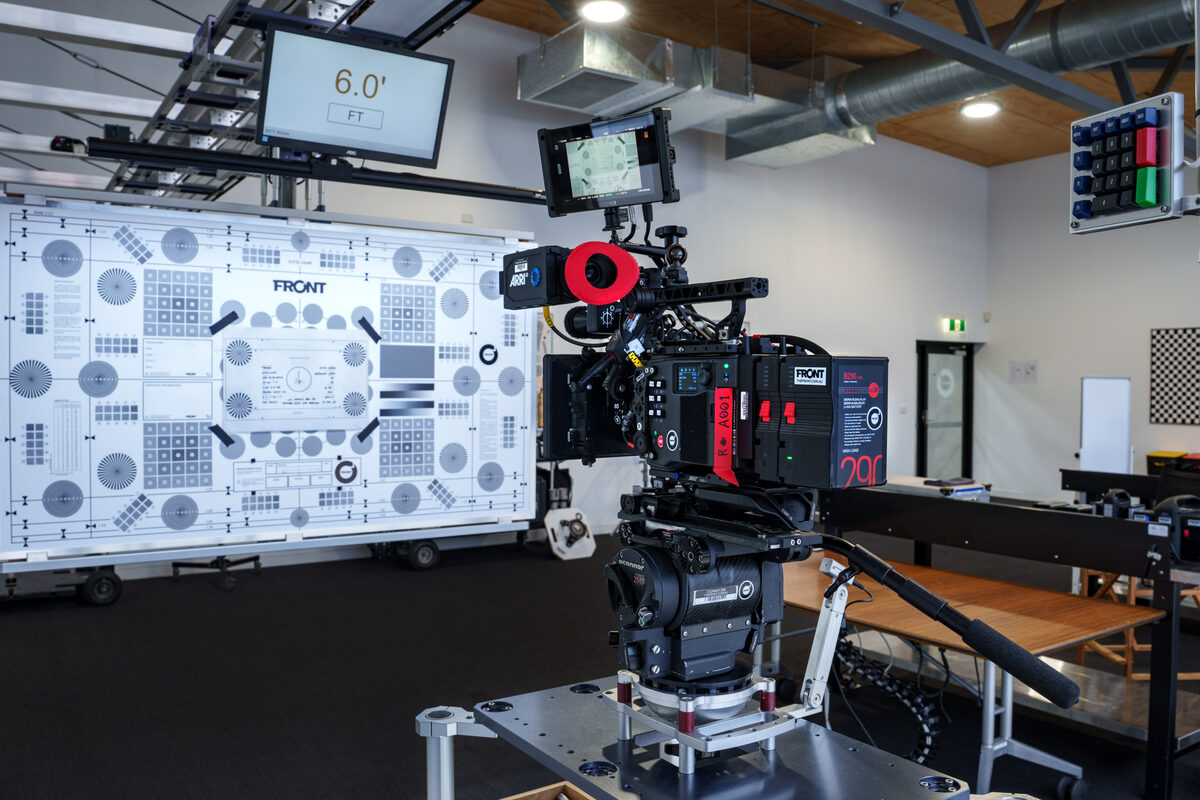A camera framed on a Focus Test Chart with the focus-distance monitor overhead